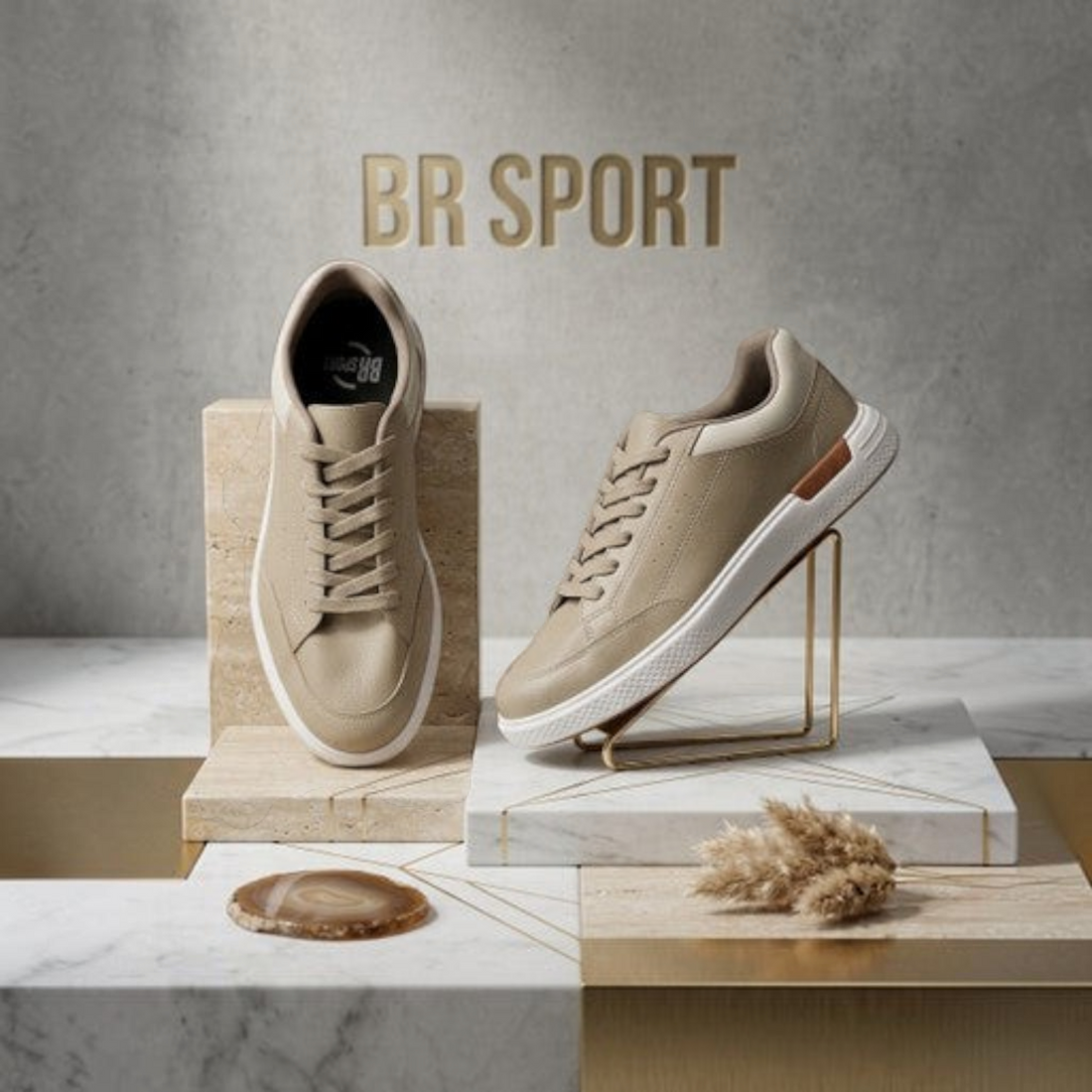 MOODBOARD BR Sport beige sneakers with white soles displayed on marble and stone pedestals in a studio setting.