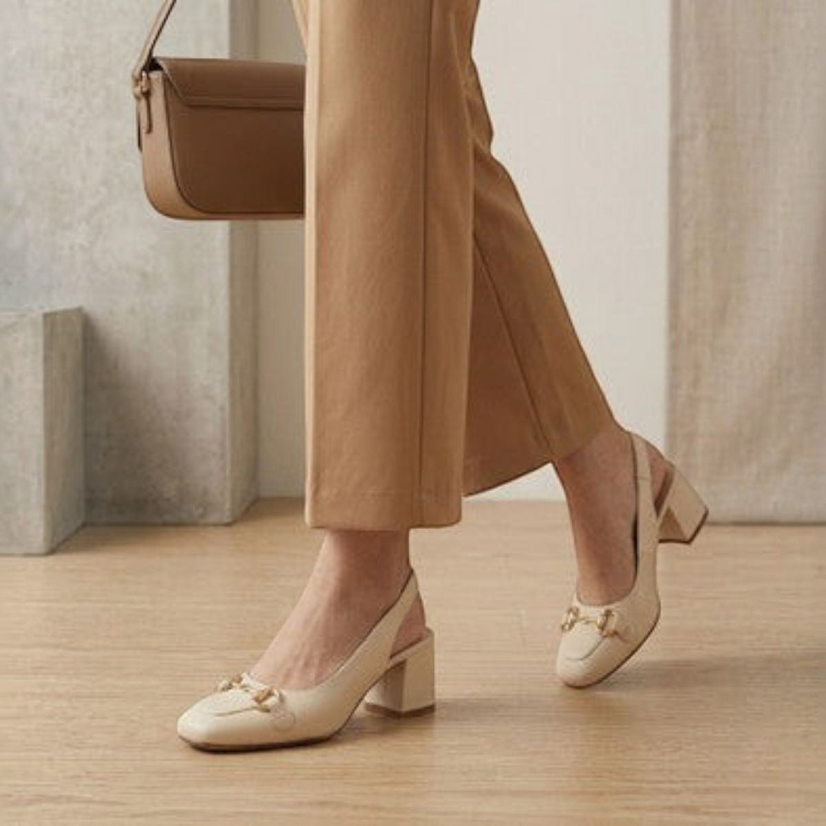 MOODBOARD cream square-toe slingback pumps with block heel and gold horsebit detail worn with tan trousers